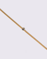 Closeup details of the Bicolor Sapphire Fold Bracelet on light color background.