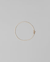 White Seed Pearl Bracelet on light color background.