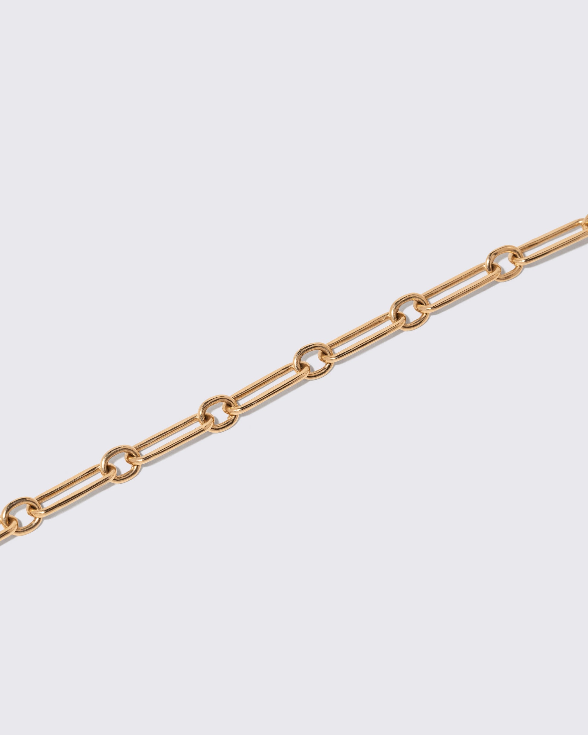 Petite Link Bracelet on light color background.