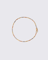 Tricolor Butter Chain Bracelet on light color background.