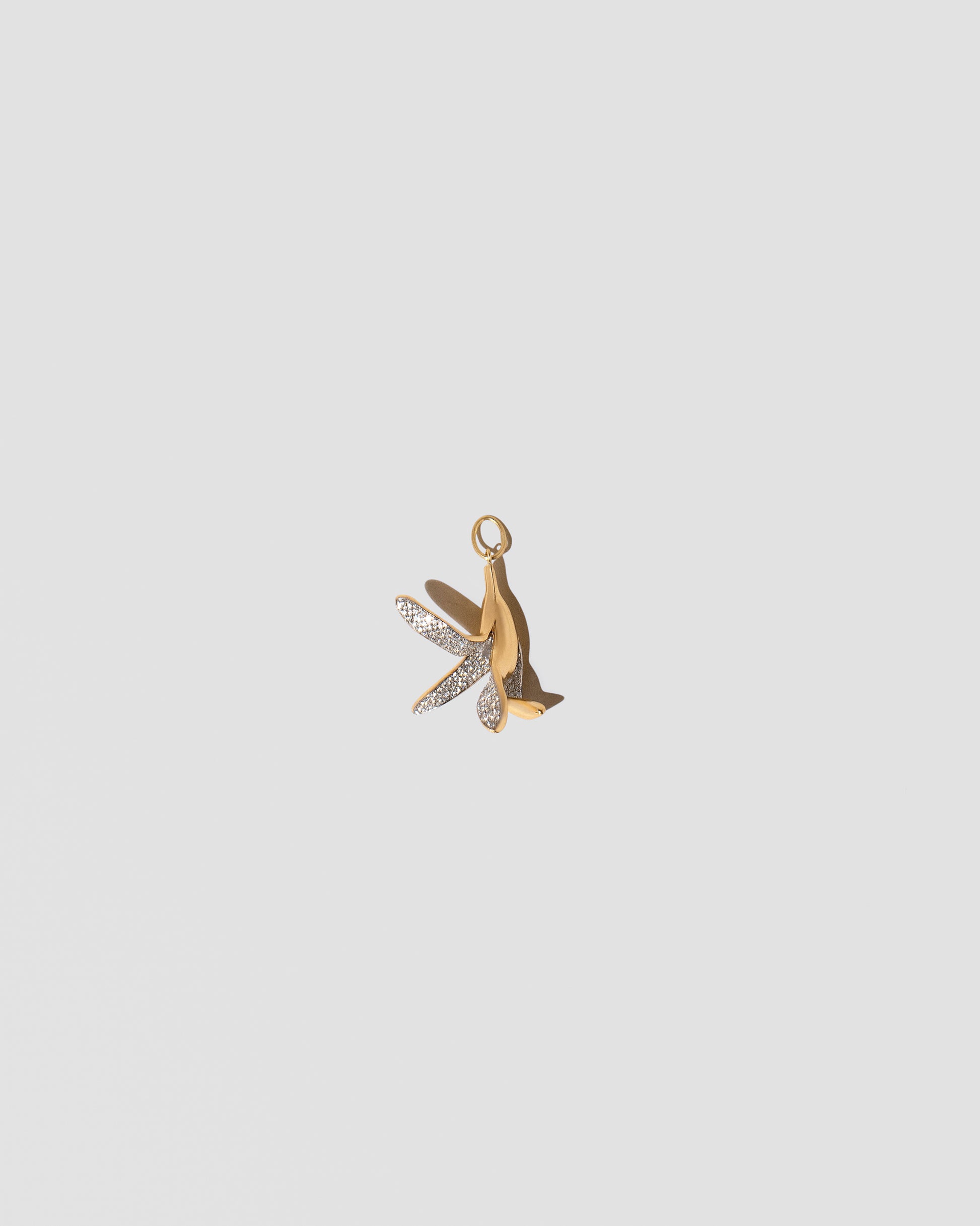 Banana Peel Charm on light color background.