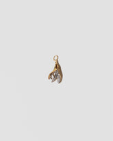 Bruised Banana Peel Charm on light color background.
