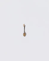 Cereal Spoon Charm on light color background.