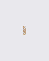 Cosmic Balance Link Charm on light color background.