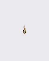 Green Sapphire Gusher Charm on light color background.