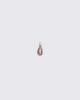 Purple Sapphire Gusher Charm on light color background.