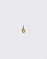 Yellow Sapphire Gusher Charm on light color background.