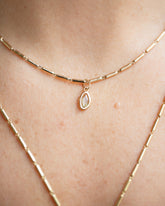 Yellow Sapphire Gusher Charm and Gold Butter Chain Necklace on model.