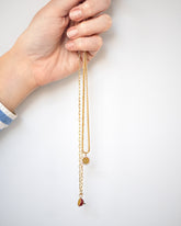 Halved Passion Fruit Charms with the 2.2mm Beveled Oval Chain Necklace and 1.5mm Ritual Chain Necklace on model.