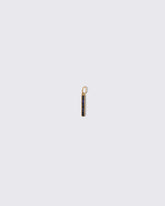 Sapphire Identity Charm on light color background.
