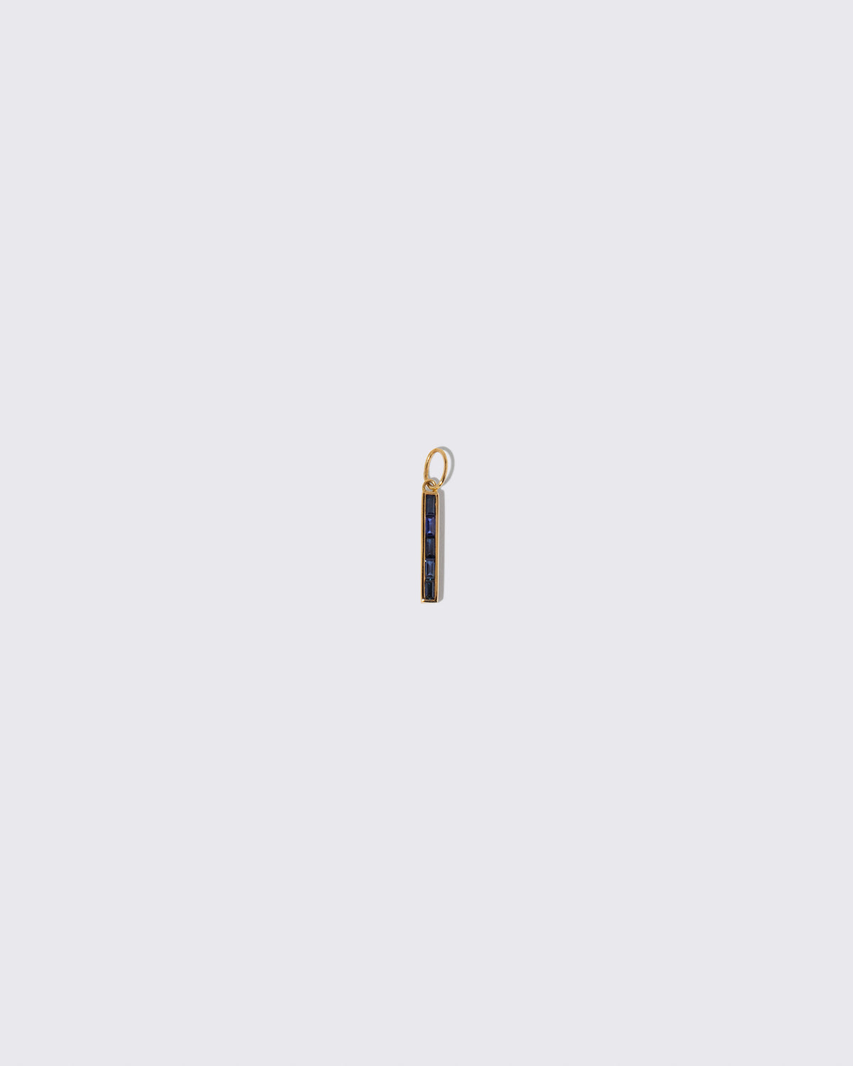 Sapphire Identity Charm on light color background.