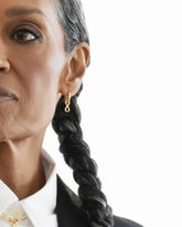 Styled image on model featuring the Infinity Styling Link on the Styling Huggie Hoop Earring Single and Link Necklace.