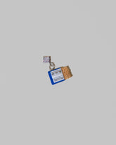 View from the back of the Instant Ramen Charm on light color background.