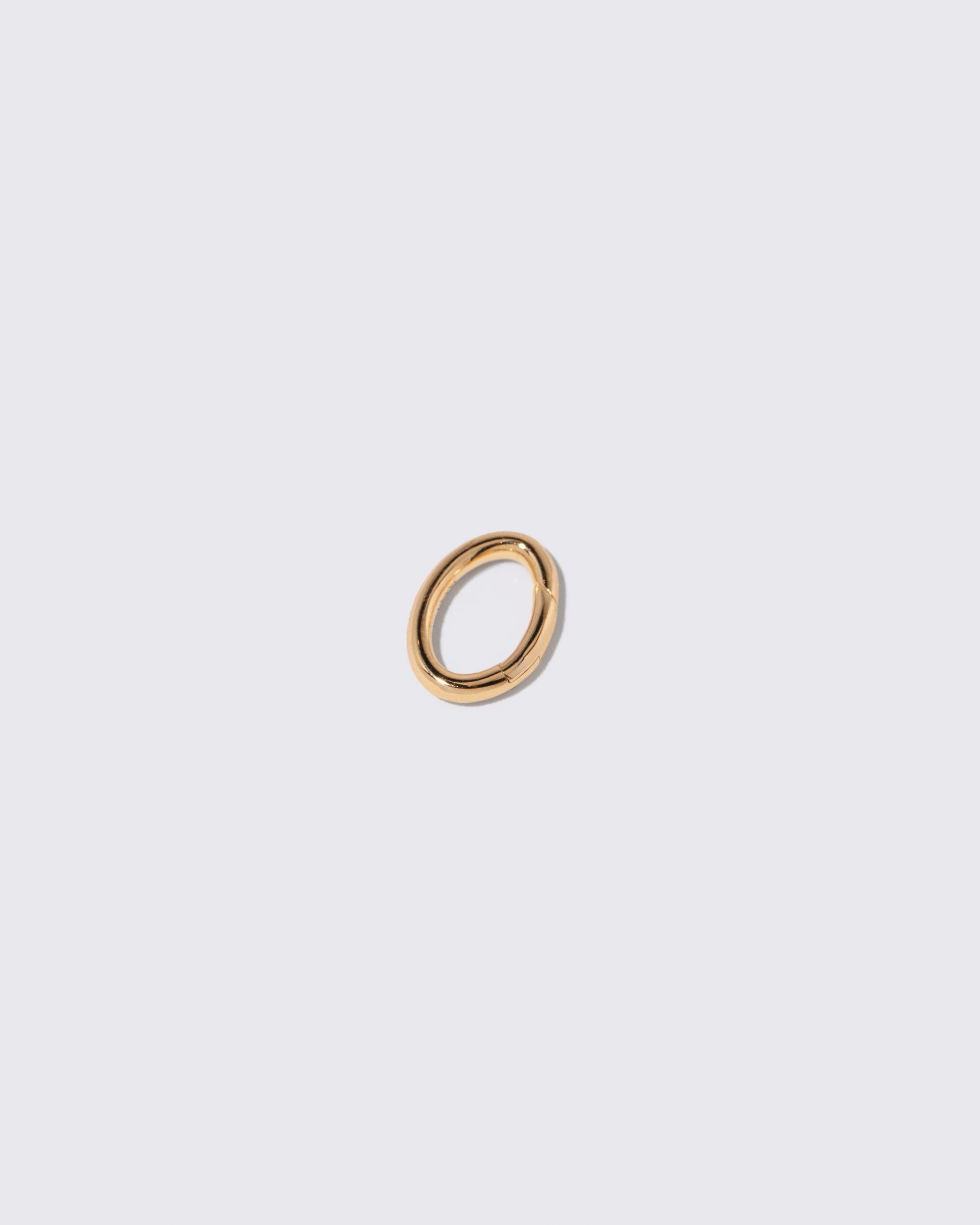 Closeup details of the Long Oval Openable Link on light color background.
