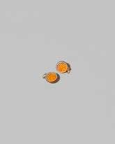 Passion Fruit Charms on light color background.
