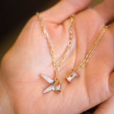 product_details::2.2mm Beveled Oval Chain Necklace with Banana Peel Charm, Red Apple Core Charm with Petite Diamond Cut Chain Necklace and Gold Bump Band on model.