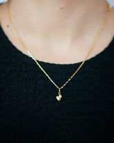 Hot Dog Chain Necklace and Gold Thousand & One Night Heart Charm on model.