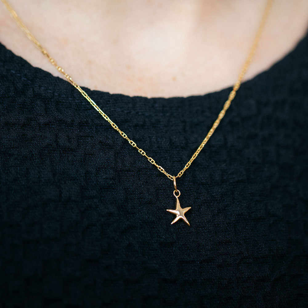 product_details::Hot Dog Chain Necklace and Gold Verve Five Point Star Charms on model.