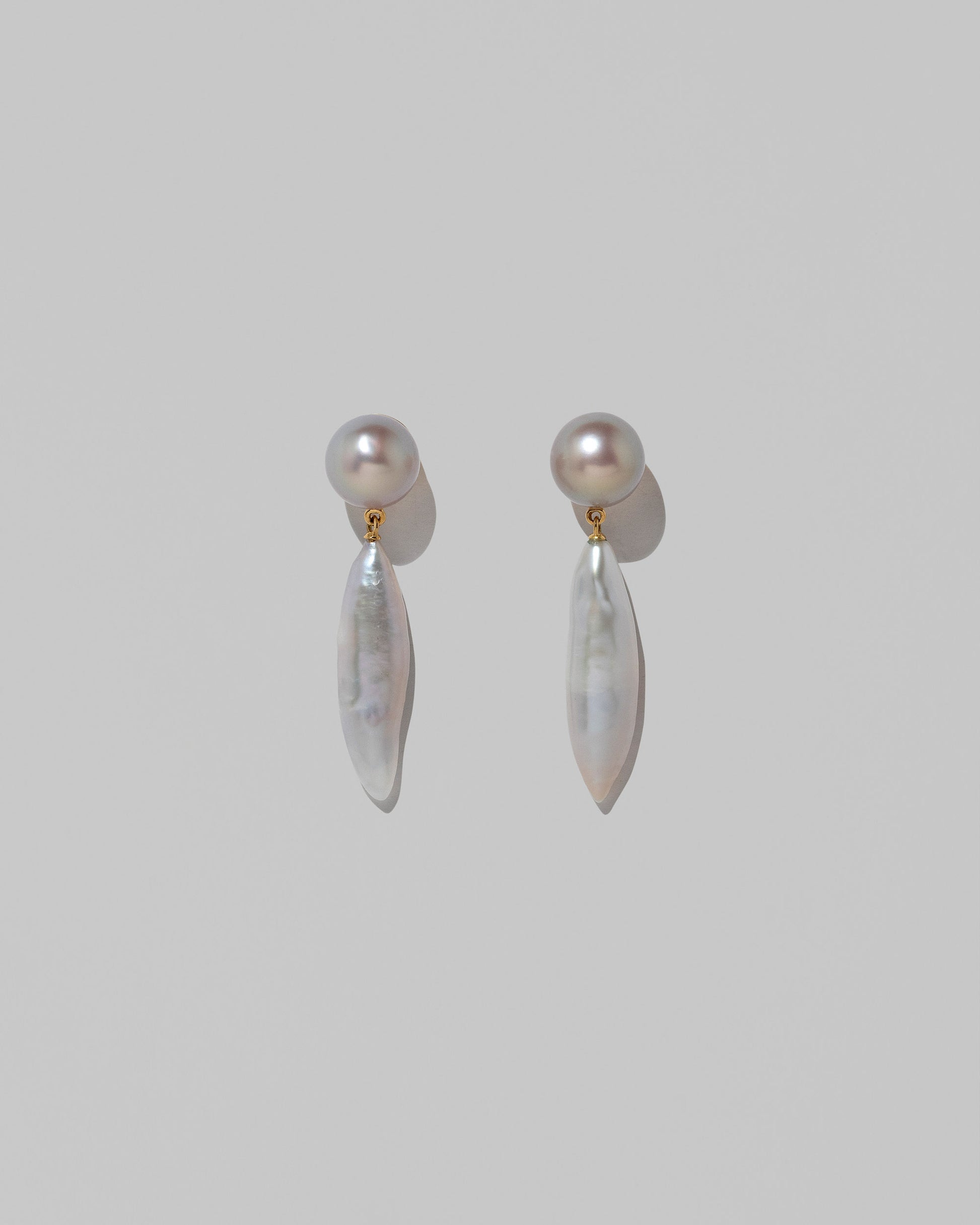 Aphrodite Earrings on light color background.