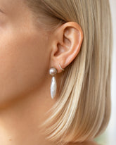 Aphrodite Earrings and Huggie Diamond Snack Hoop Earrings on model.