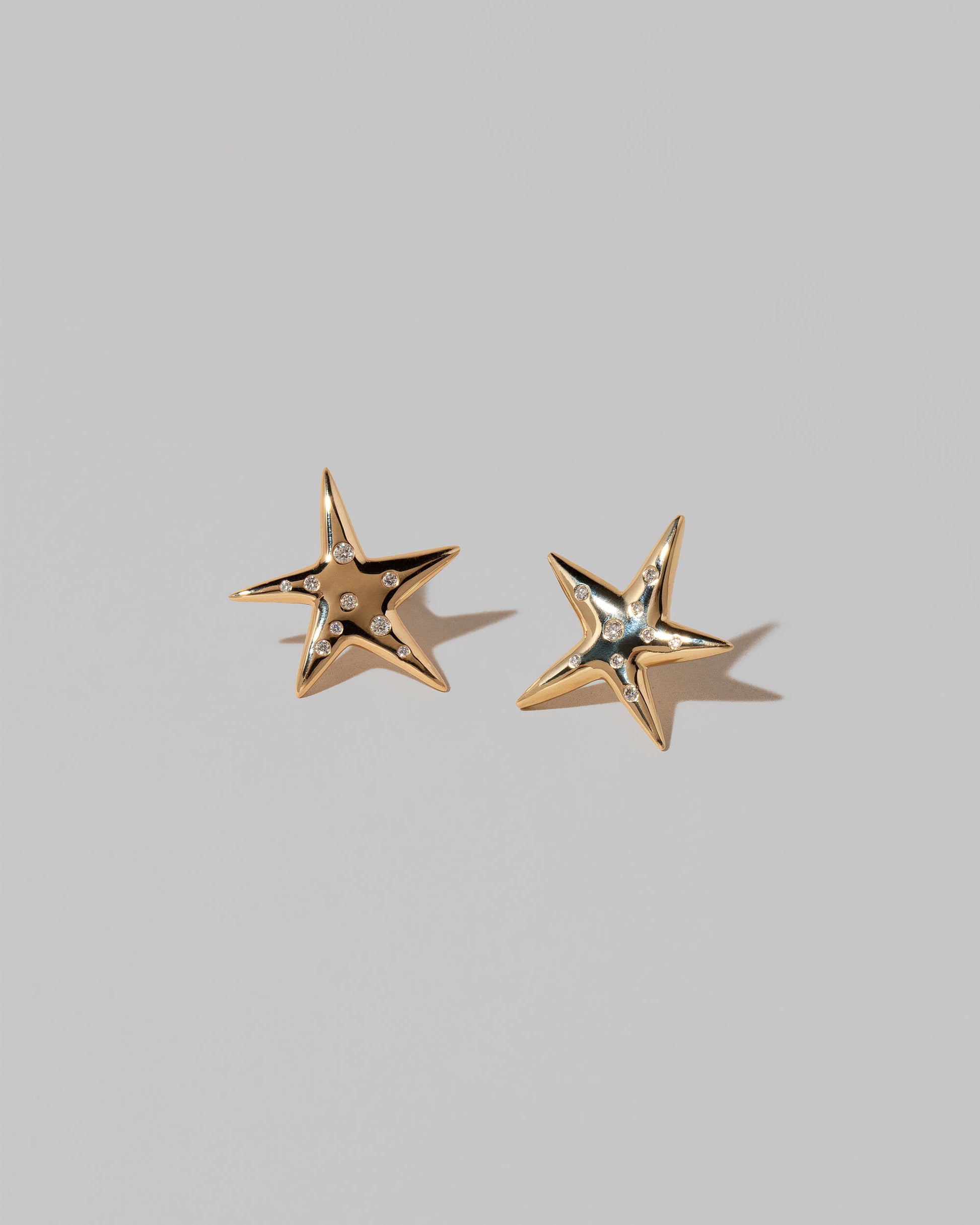 Verve Interstellar Stud Earrings on light color background.