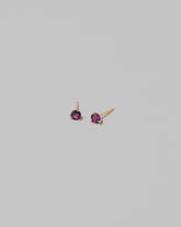 Petite Bicolor Purple Sapphire Martini Stud Earrings on light color background.