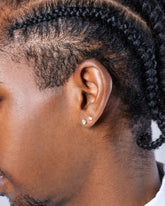 Standard White Diamond Martini Stud Earrings and Grand White Diamond Martini Stud Earrings on male model.