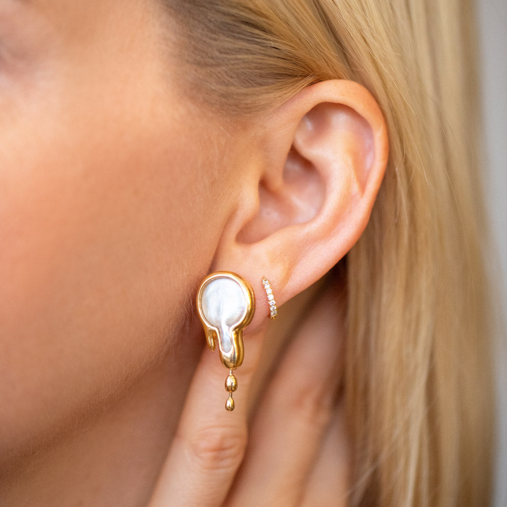 product_details::Melt Earrings on model.