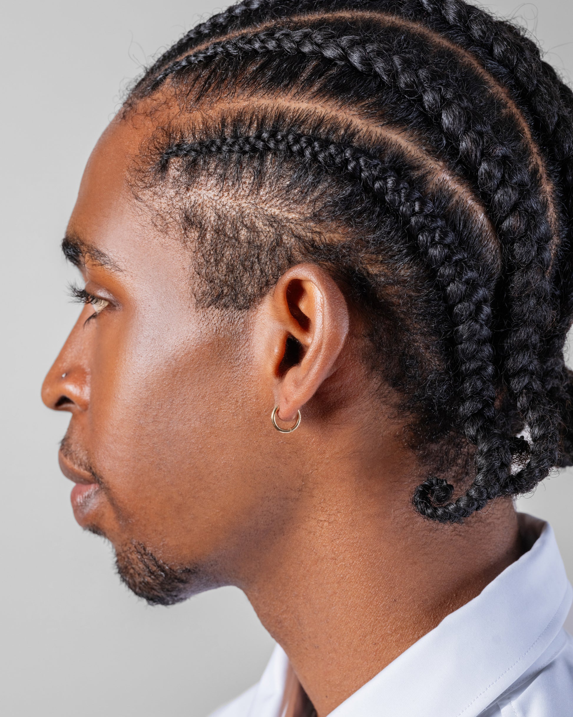 Classic Gold Solid Snack Hoop Earrings on male model.