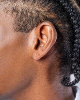 Foot Stud Earring Single and Star Stud Earring Single on male model.