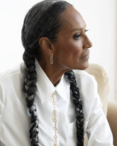 Styled image on model featuring Styling Huggie Hoop Earrings with Styling Link and Link Necklace.