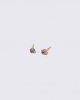 Bicolor Sapphire Sun & Moon Stud Earrings on light color background.
