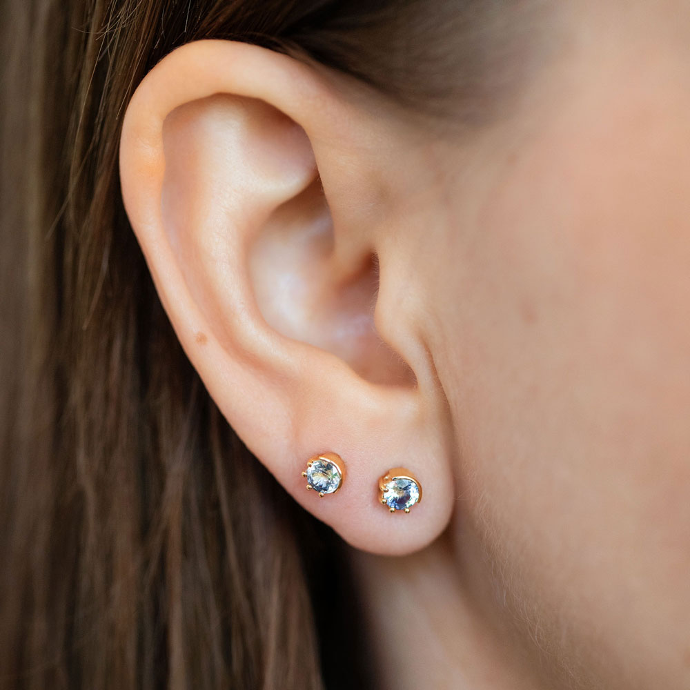 product_details::Bicolor Sapphire Sun & Moon Stud Earrings on model.