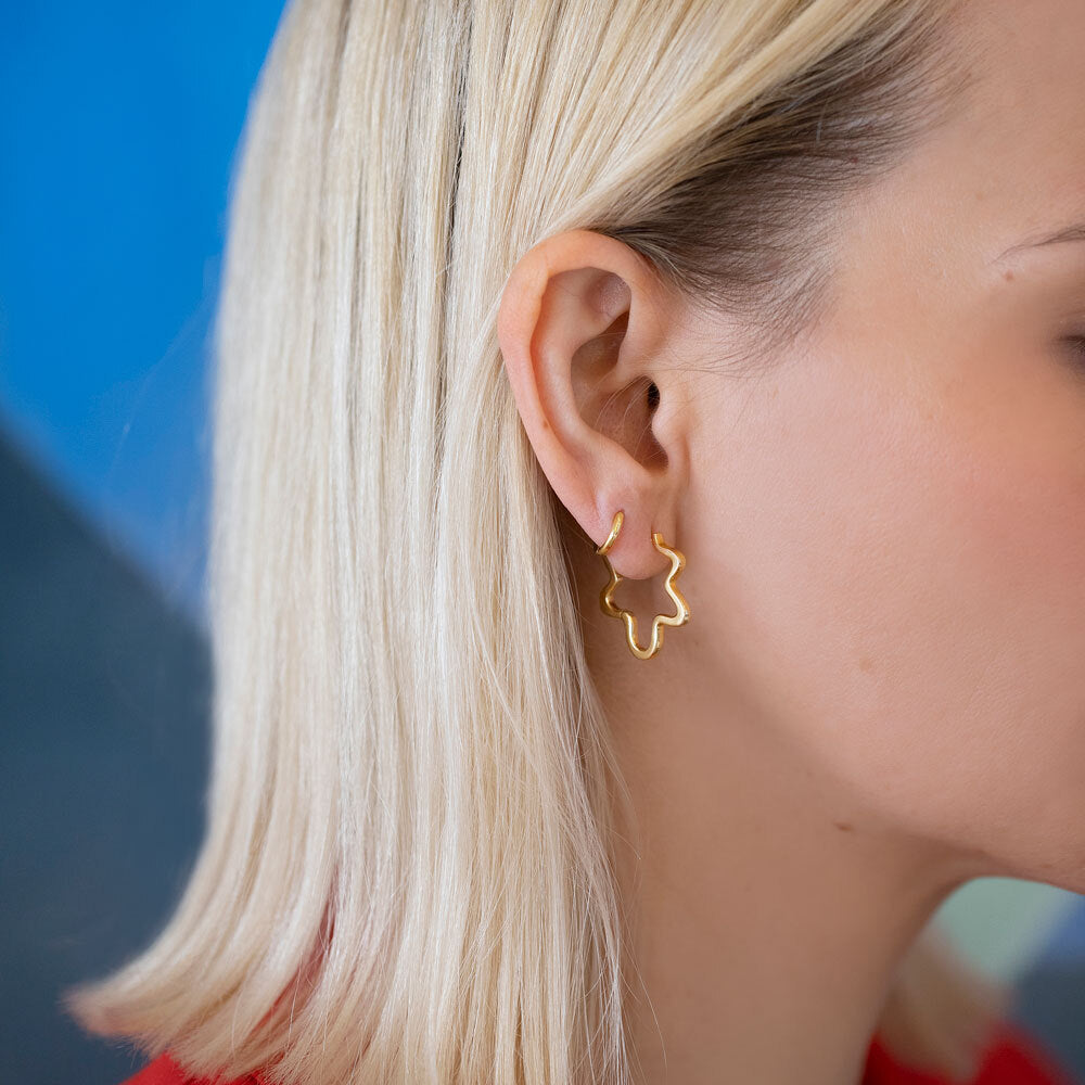 product_details::Gold Wild Poppies Hoop Earrings on model.