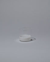 Ichendorf Milano White/Clear Light Colore Water Glass on light color background.