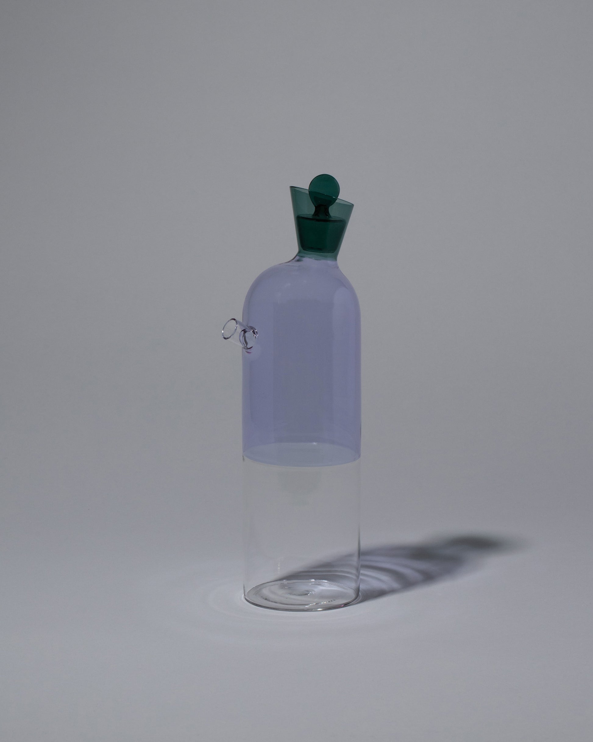 Ichendorf Milano Clear/Lilac/Green Travasi Bottle on light color background.
