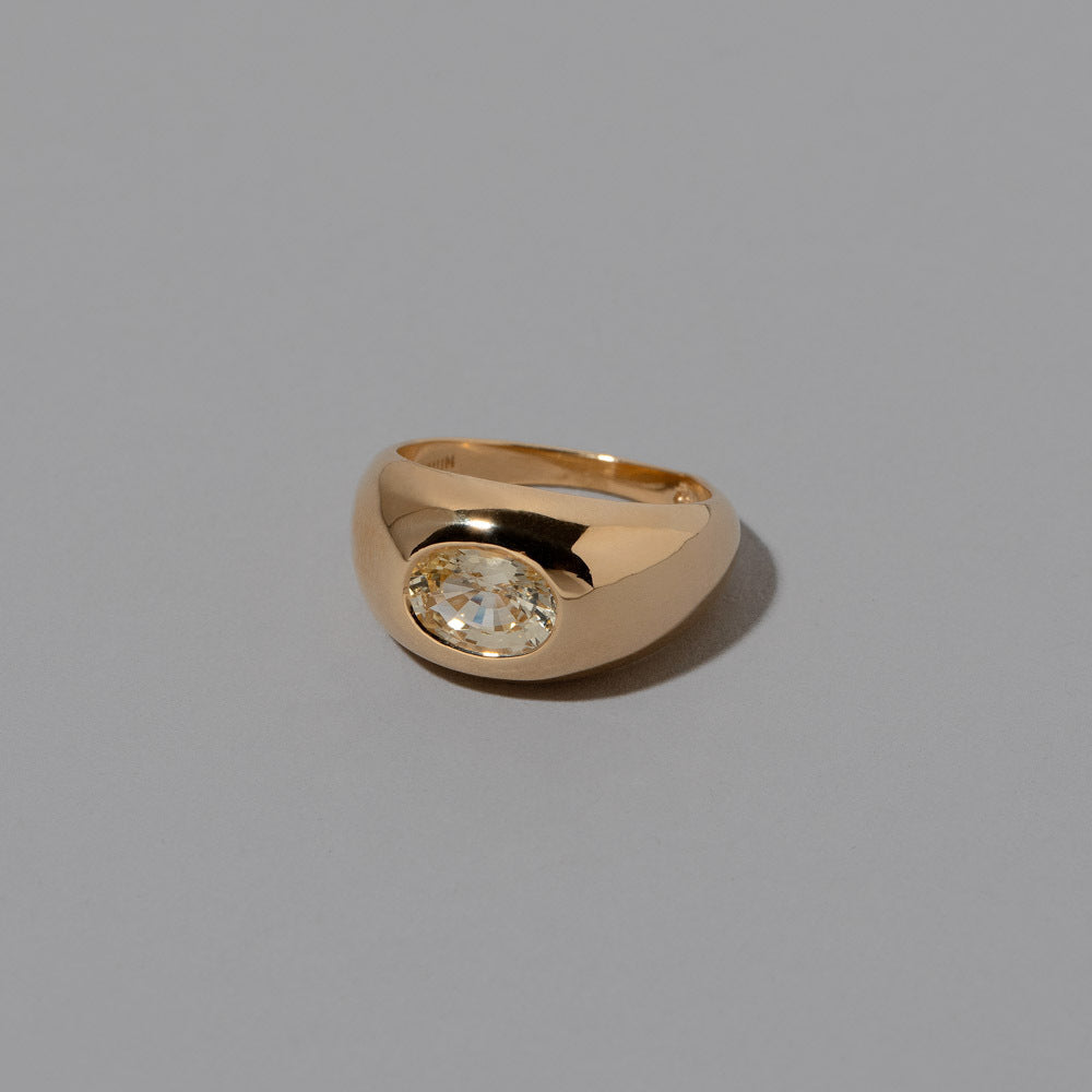 product_details::Closeup details of the Yellow Sapphire Jupiter Ring on light color background.