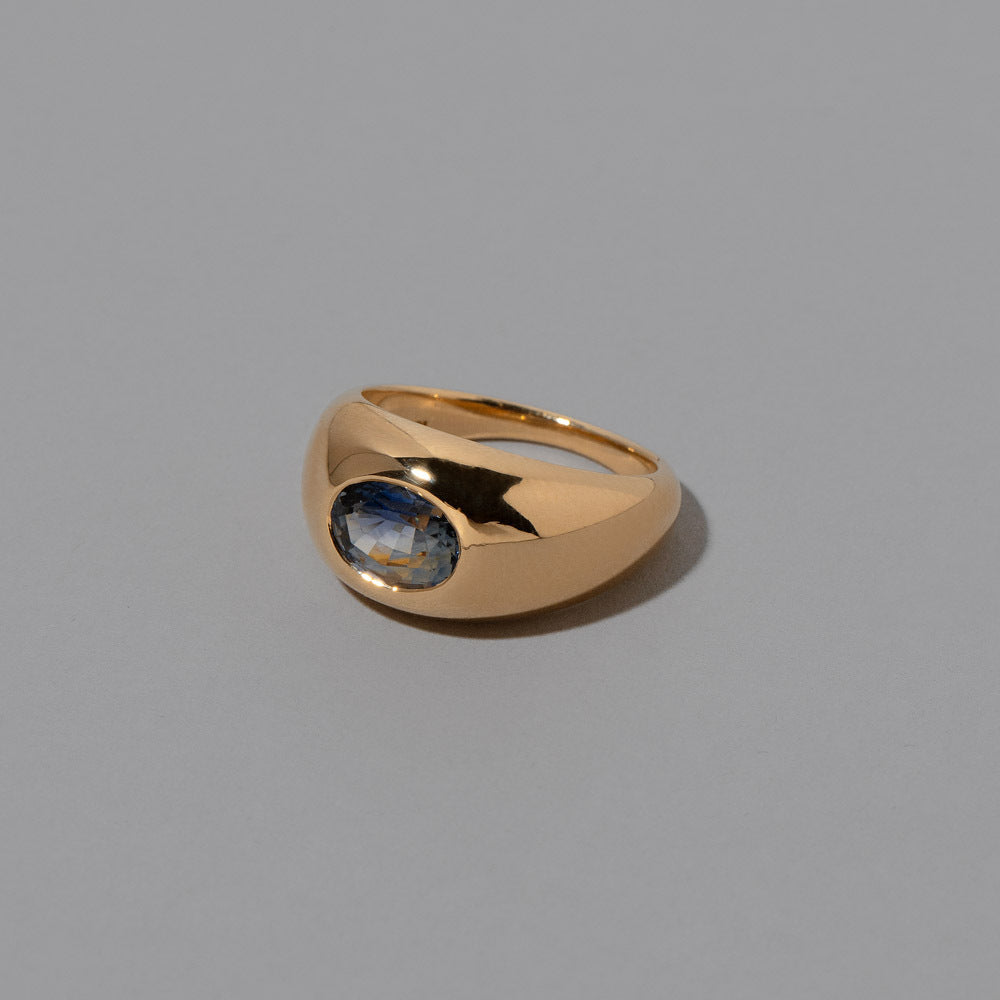 product_details::Closeup view of the Bicolor Sapphire Jupiter Ring on light color background.