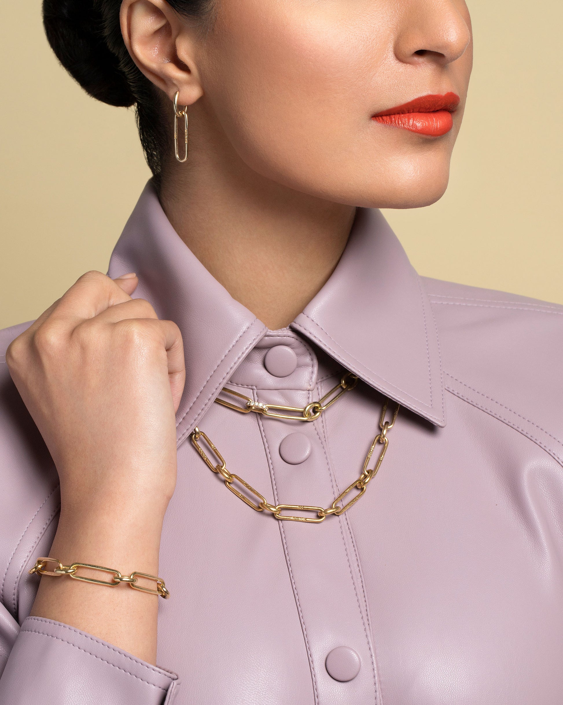 Link Huggie Hoop Earrings, Pavé Link Necklace, Link Necklace and Link Bracelet on model.