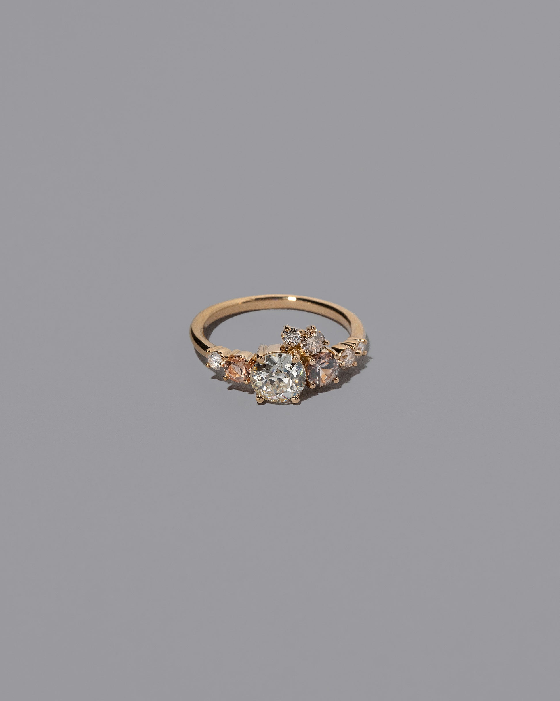 Peach Sapphire & Diamonds Luna Ring on light color background.