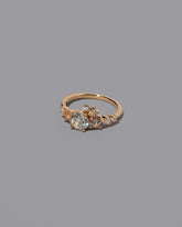 View from the side of the Peach Sapphire & Diamonds Luna Ring on light color background.