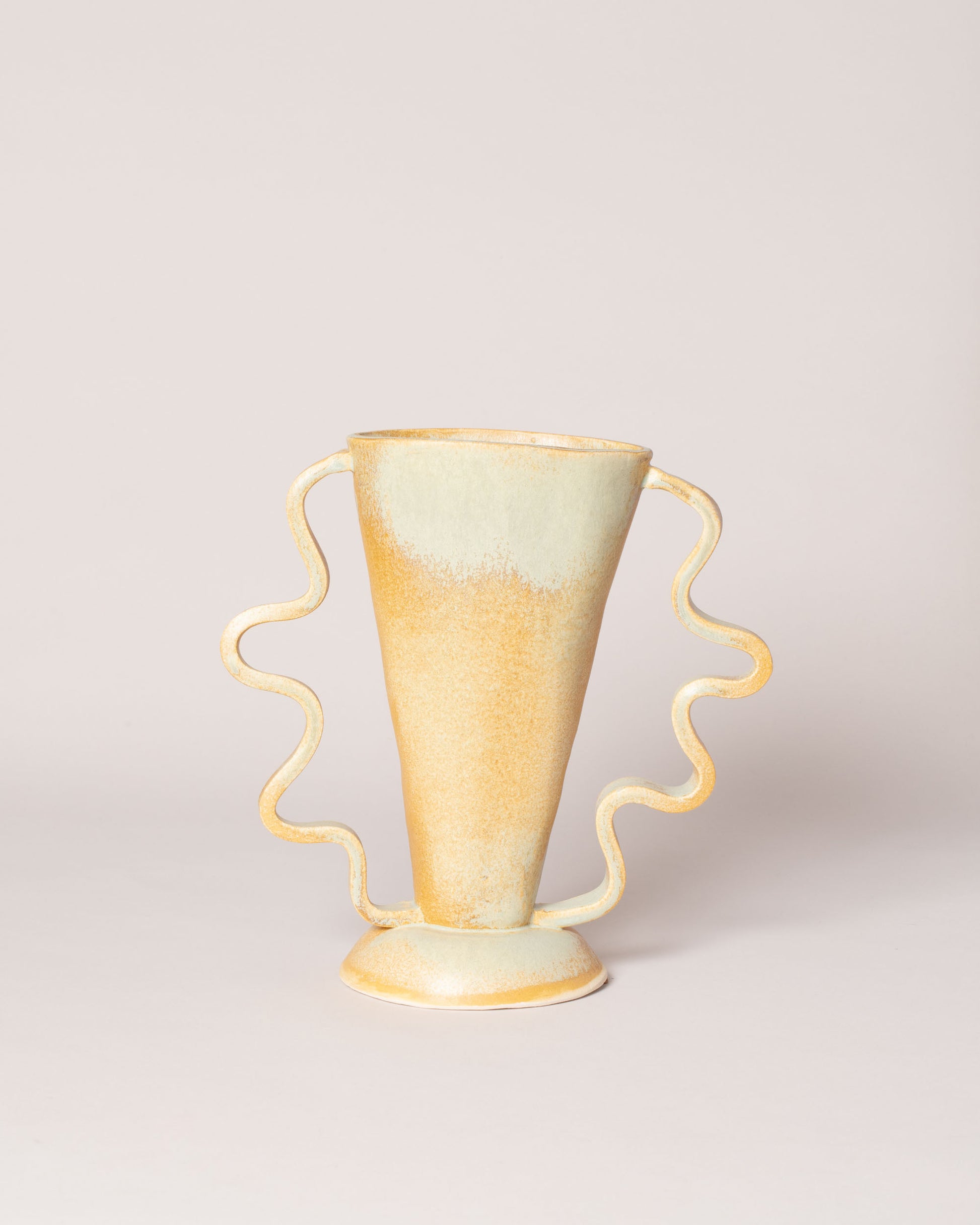 Morgan Peck Clouded Yellow Stretch Vase on light color background.