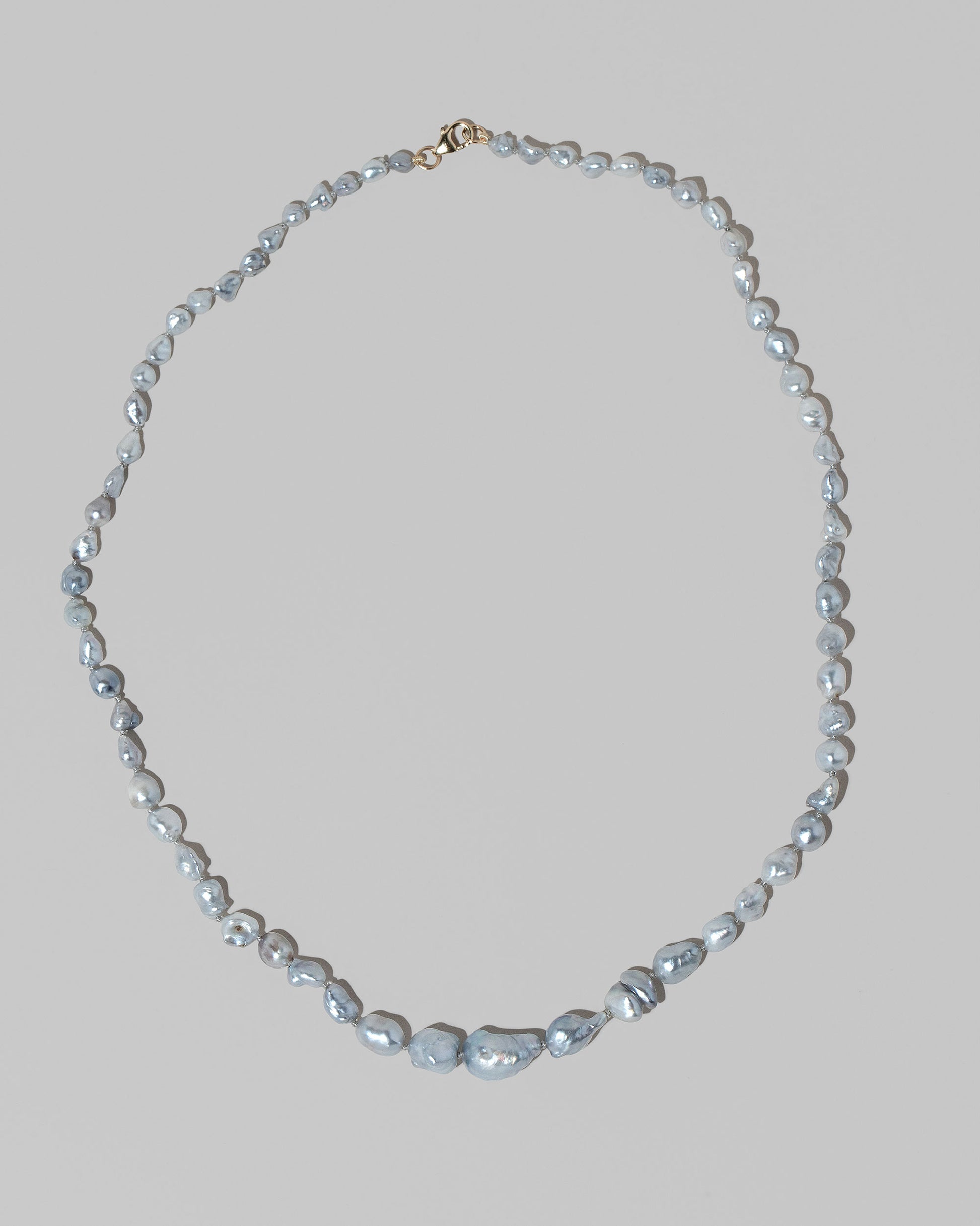 Ula Pearl Necklace 001 on light color background.