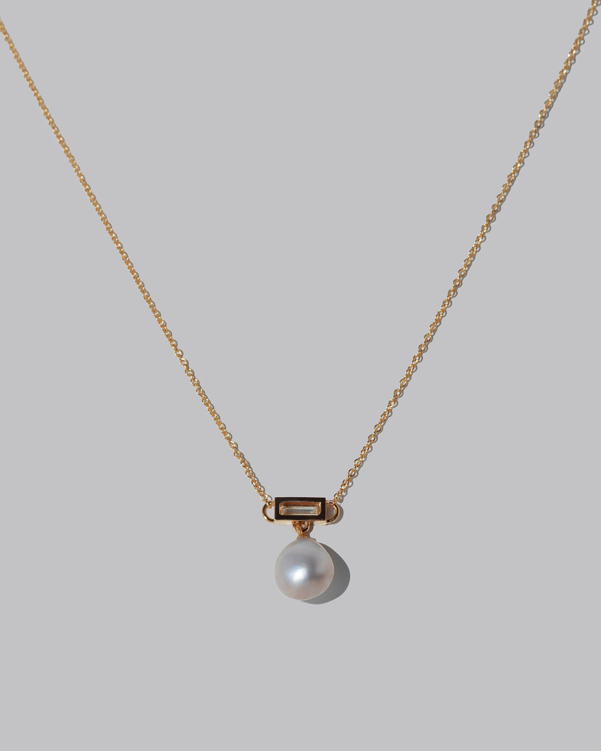 Closeup details of the Poseidon Necklace on light color background.