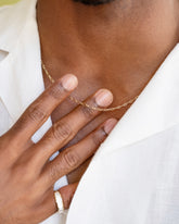 Hot Dog Chain Necklace and Gold Arcade Ring on male model.