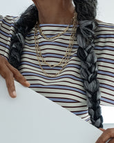 Styled image on model featuring the Infinity Openable Link Necklace, Link Necklace with its Coiled Swivel Charm Holder clasp centered, and a Petite Link Necklace.