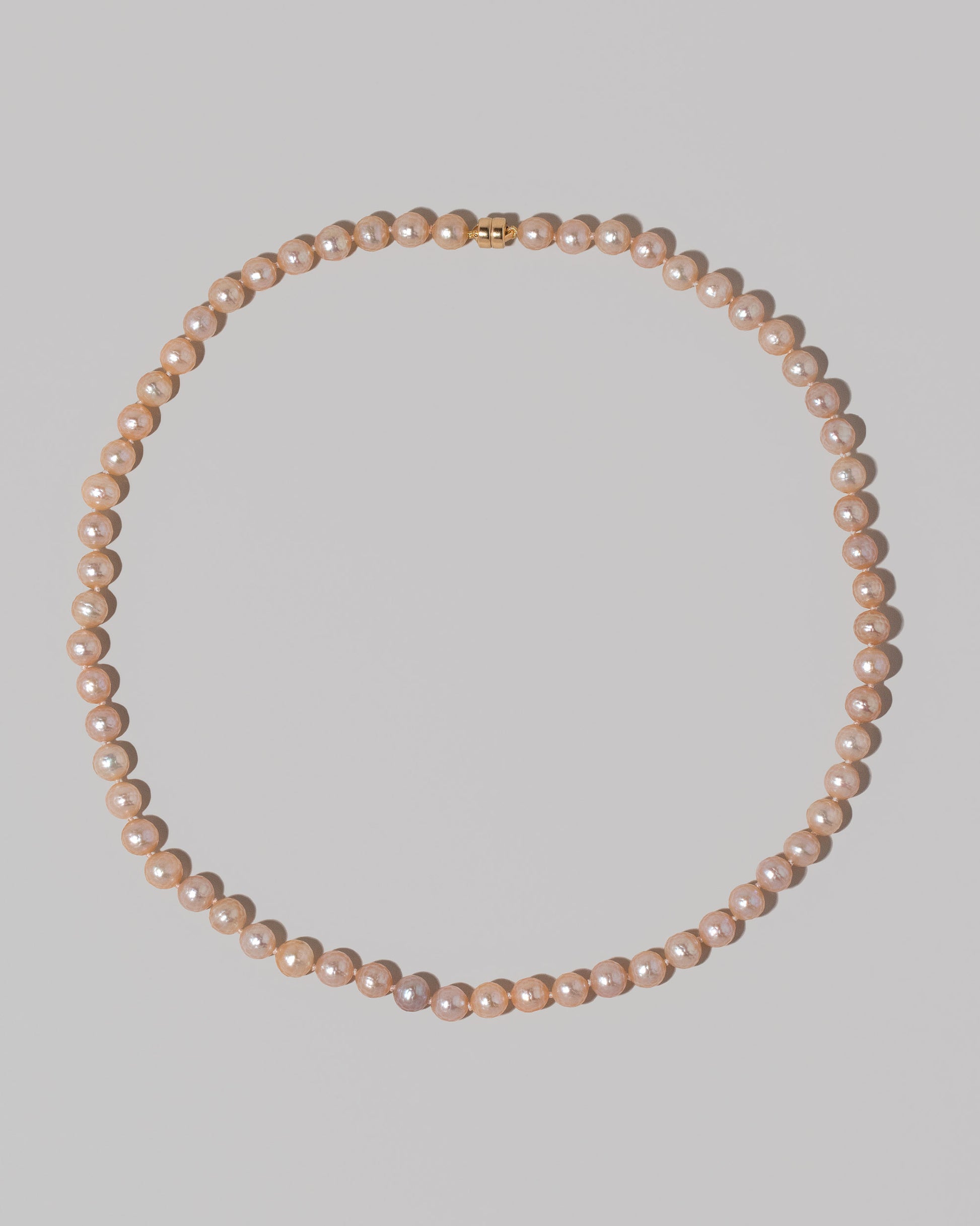 Faceted Sugar Pearl Necklace on light color background.