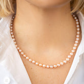 product_details::Faceted Sugar Pearl Necklace on model.