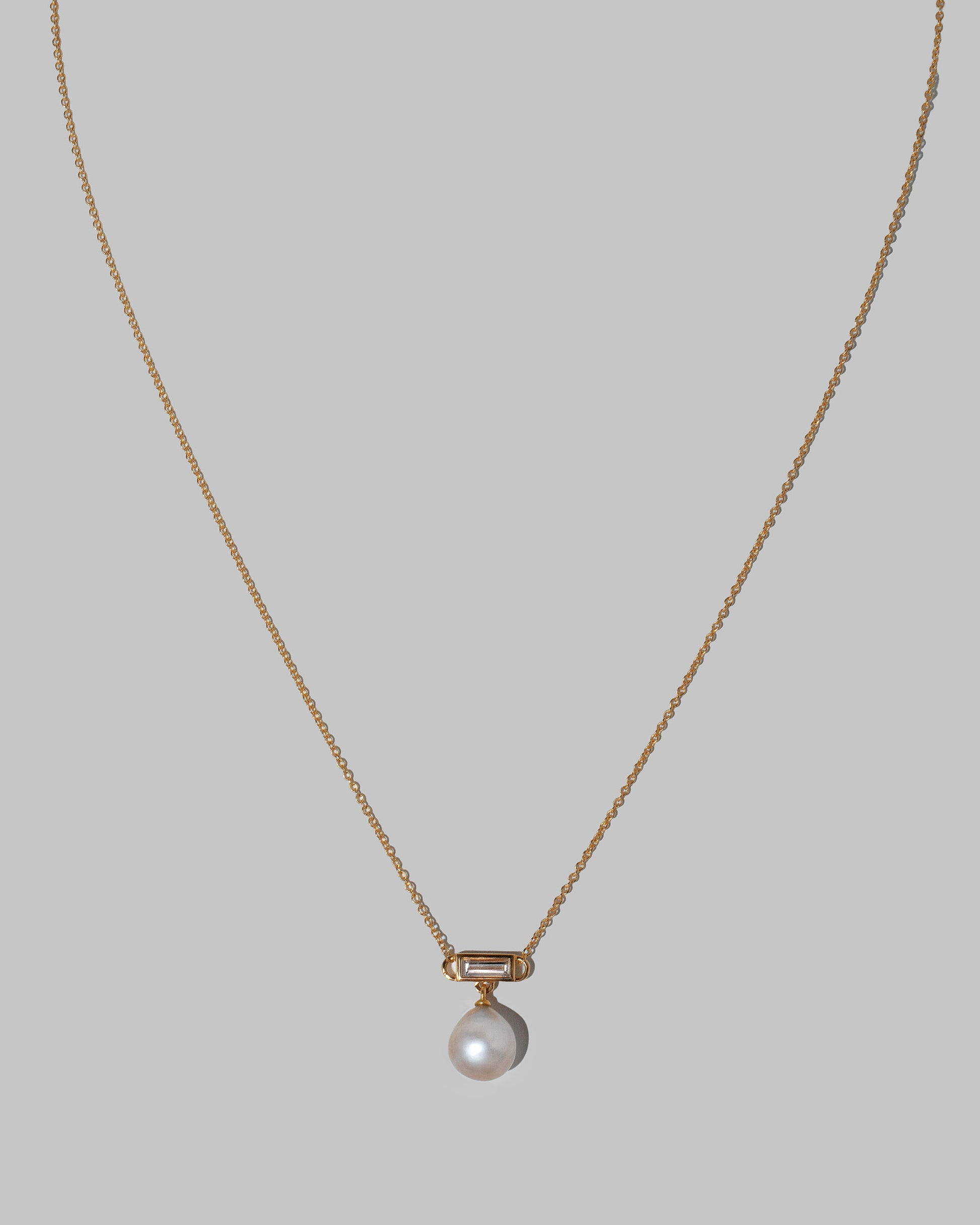 Closeup details of the Poseidon Necklace on light color background.