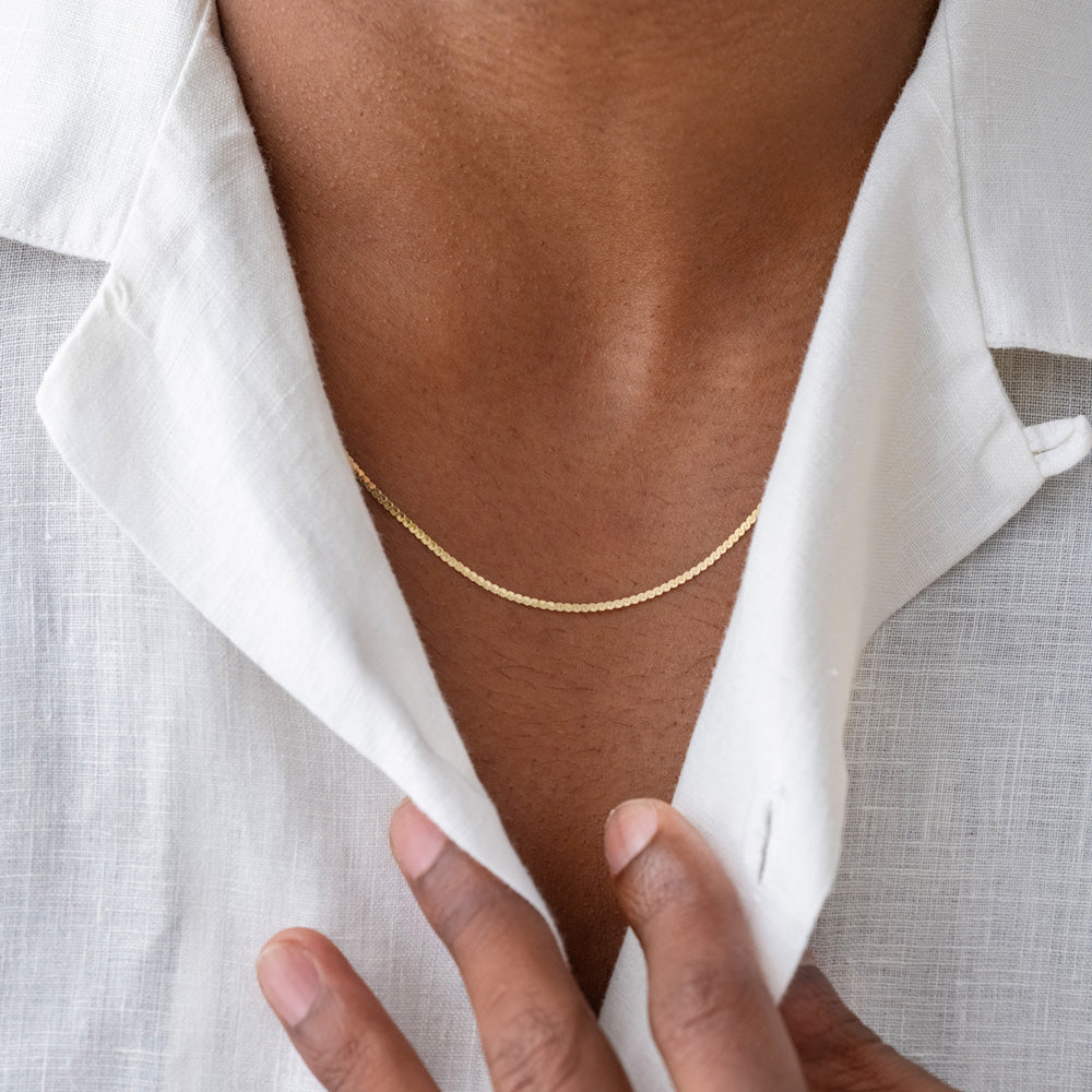 product_details::Serpentina Chain Necklace on male model.